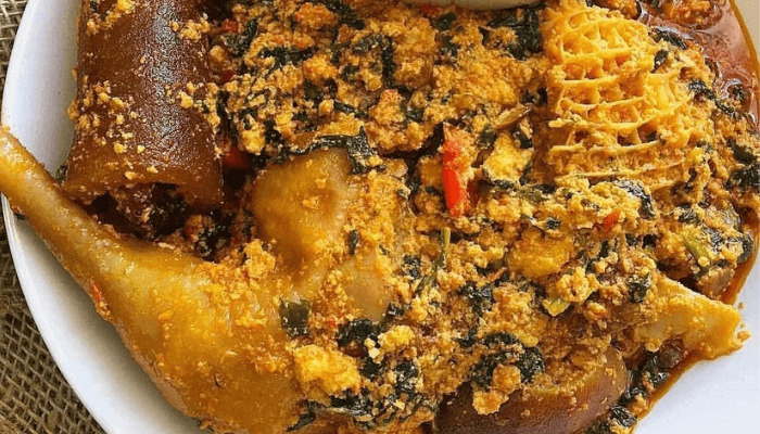 Egusi Soup Chicken with Poundo Yam - Traditional Nigerian egusi soup with tender chicken served with smooth poundo yam