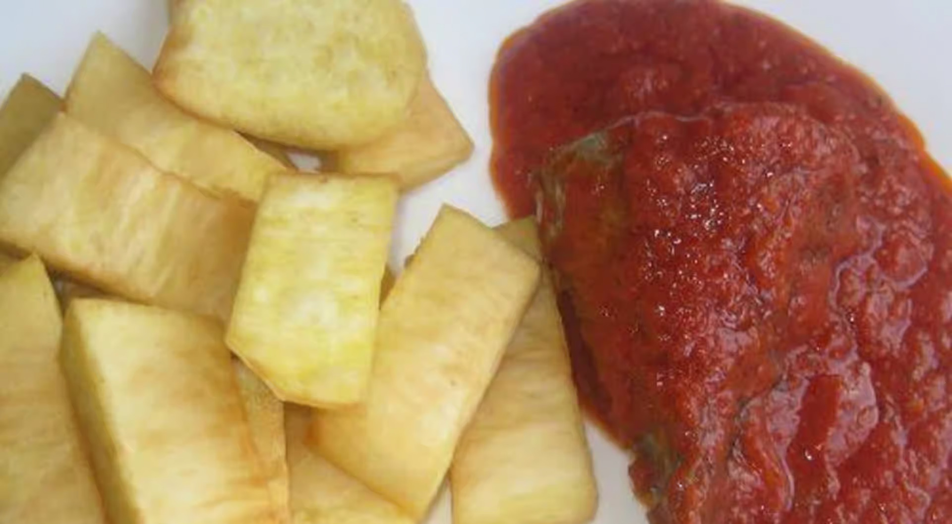 Yam Fries (Nigerian) with Tomatoes Gravy with Fish 2pc - Crispy Nigerian yam fries served with rich tomato gravy and two pieces of seasoned fish